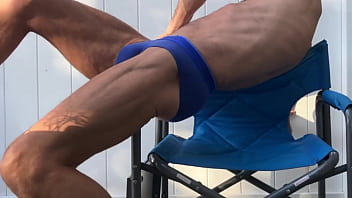 Deep pelvic stretching in blue briefs on blue chair late october 2024