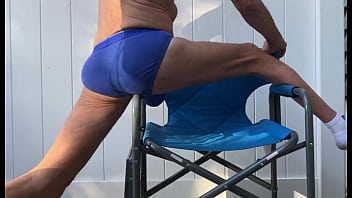 Deep Pelvic Stretching In Blue Briefs On Blue Chair Late October 2024 thumbnail