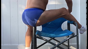 Deep pelvic stretching in blue briefs on blue chair late october 2024