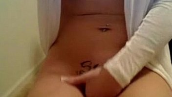 Horny cam babe plays with her pierced pussy