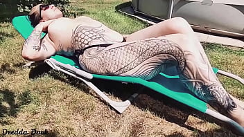 Tattooed Horny Brunette With Big Boobs Sunbathing In The Yard And Rubbing Sunscreen On Her Tits thumbnail