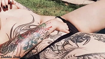 Tattooed Horny Brunette With Big Boobs Sunbathing In The Yard And Rubbing Sunscreen On Her Tits thumbnail