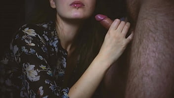 She gives a blowjob to her boyfriend in a sexy blouse and allows him to cum in her mouth