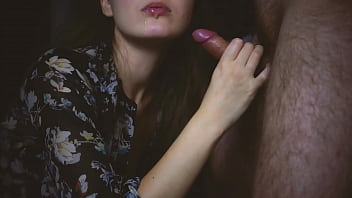 She gives a blowjob to her boyfriend in a sexy blouse and allows him to cum in her mouth