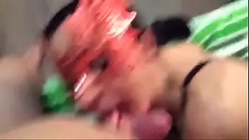 Couple In Masks In Front A Camera thumbnail