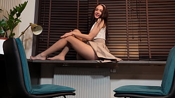 Emily in skirt and pantyhose rubbing legs in tease