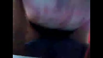 Woman lying on bed in her underwear