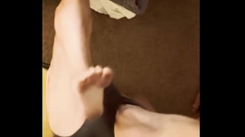 Sneak peak from above stretching in grey briefs on stool and bed