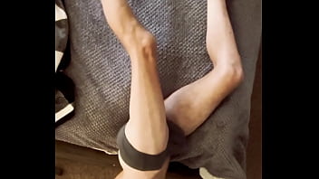 Sneak peak from above stretching in grey briefs on stool and bed