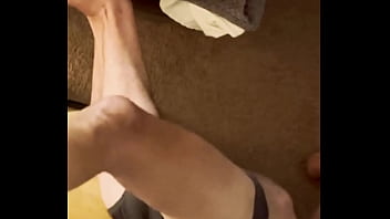 Sneak peak from above stretching in grey briefs on stool and bed