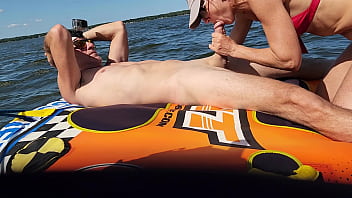 Hot athletic couple have sex on a jetski in the middle of a lake