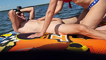 Hot athletic couple have sex on a jetski in the middle of a lake