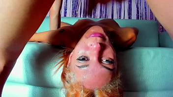 After a good blowjob she lies face up on the couch to swallow the whole cock