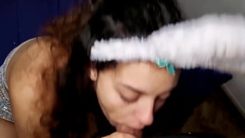 Talking on the phone with her boyfriend while sucking her off