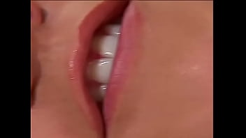 Tanned chick with round tits masturbates on a couch in the living room