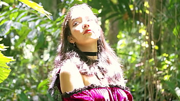 Little red riding hood walking alone in the forest