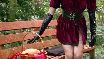 Little red riding hood walking alone in the forest