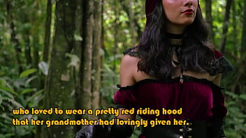 Little red riding hood walking alone in the forest