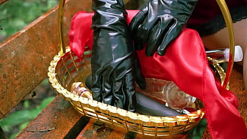 Little red riding hood walking alone in the forest