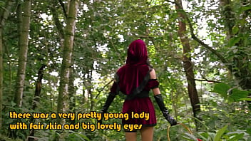 Little red riding hood walking alone in the forest