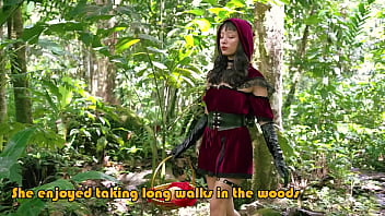 Little red riding hood walking alone in the forest