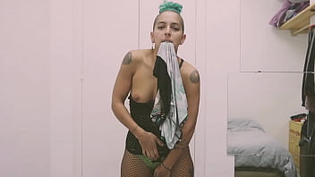 Short tattooed girl with green hair does a hot striptease