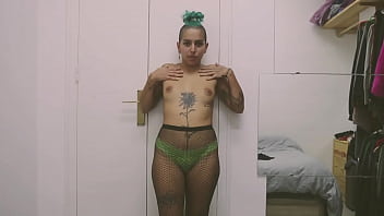 Short tattooed girl with green hair does a hot striptease