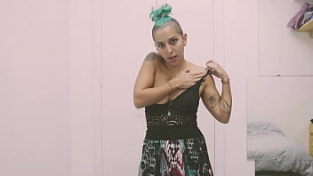 Short tattooed girl with green hair does a hot striptease