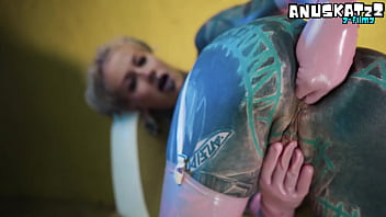 Sexy tattooed stunner in tight latex giving herself a deep double fill with toys