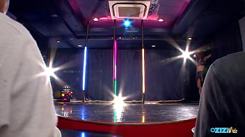 A softcore striptease performance in the alluring club environment as she captivates your attention