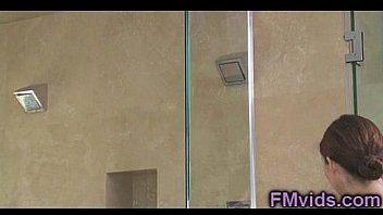 Sexy brunette with a horny guy under shower