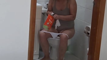 Beautiful mature woman is filmed on the beach while getting ready to fuck