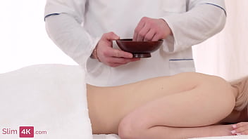 Tattooed blonde with a flexible body fucks after a massage