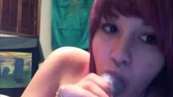 Emo cam girl sucks on her toy