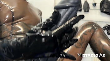 Solo 2 showcasing translucent latex outfit and hankey’s toys strap on