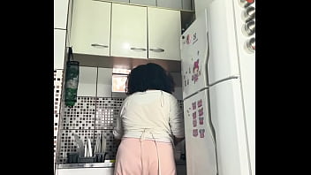 Chubby housewife farting while washing dishes voyeur style