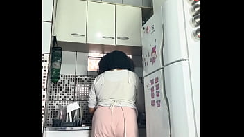Chubby housewife farting while washing dishes voyeur style
