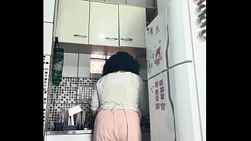Chubby housewife farting while washing dishes voyeur style