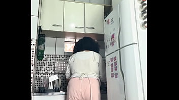 Chubby housewife farting while washing dishes voyeur style