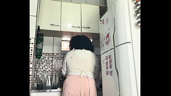 Chubby housewife farting while washing dishes voyeur style