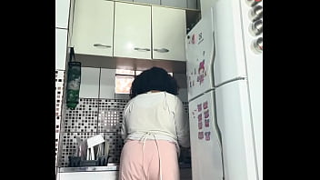 Chubby housewife farting while washing dishes voyeur style