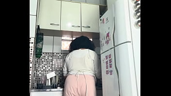 Chubby housewife farting while washing dishes voyeur style