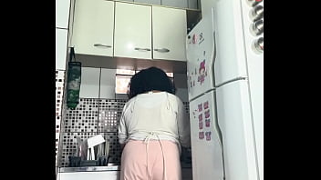 Chubby housewife farting while washing dishes voyeur style