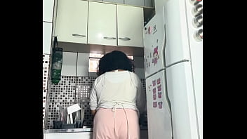 Chubby housewife farting while washing dishes voyeur style