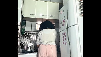 Chubby housewife farting while washing dishes voyeur style