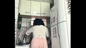 Chubby housewife farting while washing dishes voyeur style
