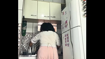 Chubby housewife farting while washing dishes voyeur style