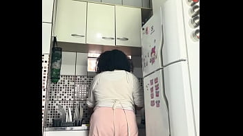 Chubby housewife farting while washing dishes voyeur style