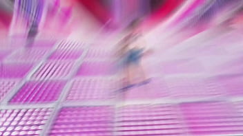 Youthful alluring saber sings and dancing on scene in a skimpy latex outfit