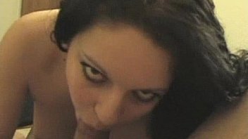 Amateur brunette gives blowjob to a big cock
